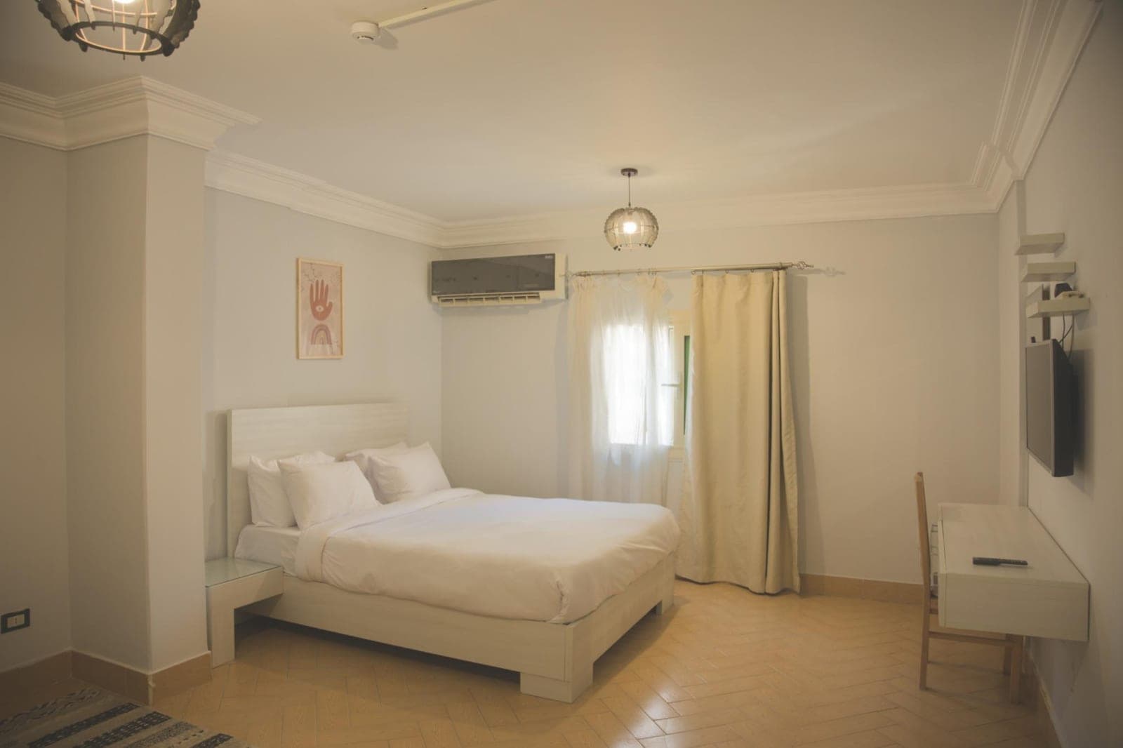 A bedroom in Suite 6, Zamalek Suites